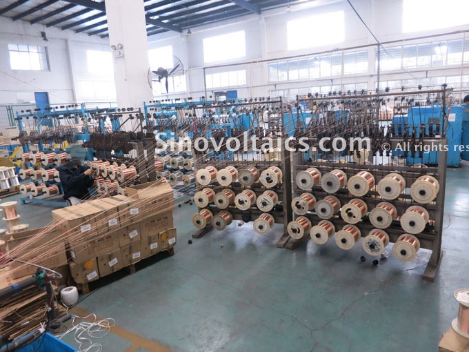 Reels of stocked copper wire being prepared for production